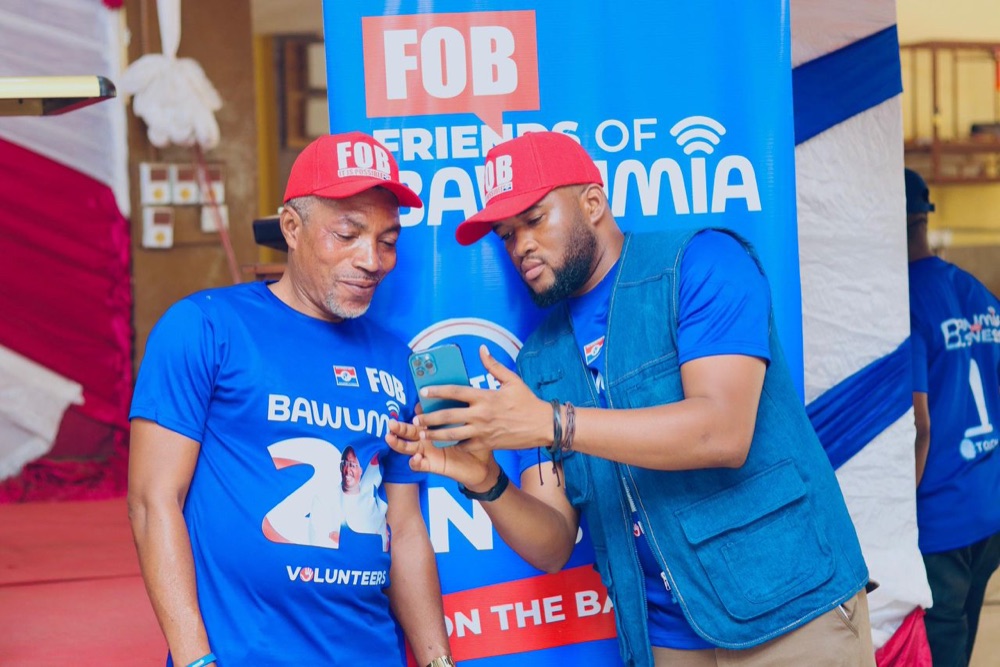 Two FOB volunteers standing together at a community event